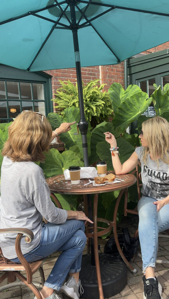 mom-and-daughter-wearing-gray-shirts-looking-at-plants-at-castaway-cafe-gloucester