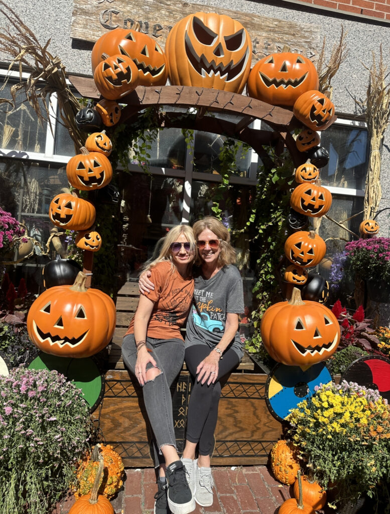 blonde-daughter-and-red-haired-mom-posting-under-pumpkins-in-salem