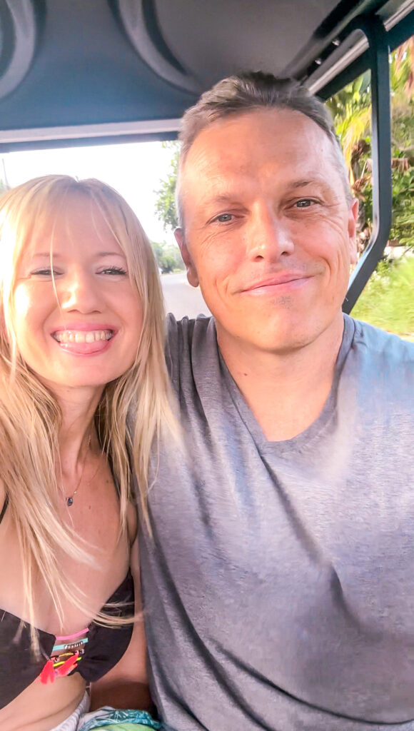 happy-married-couple-on-golf-cart-rental-in-placencia-belize