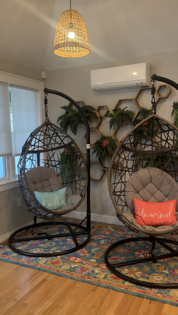 beach-inspired-chairs-with-pillows-that-say-unwind-in-gloucester-airbnb