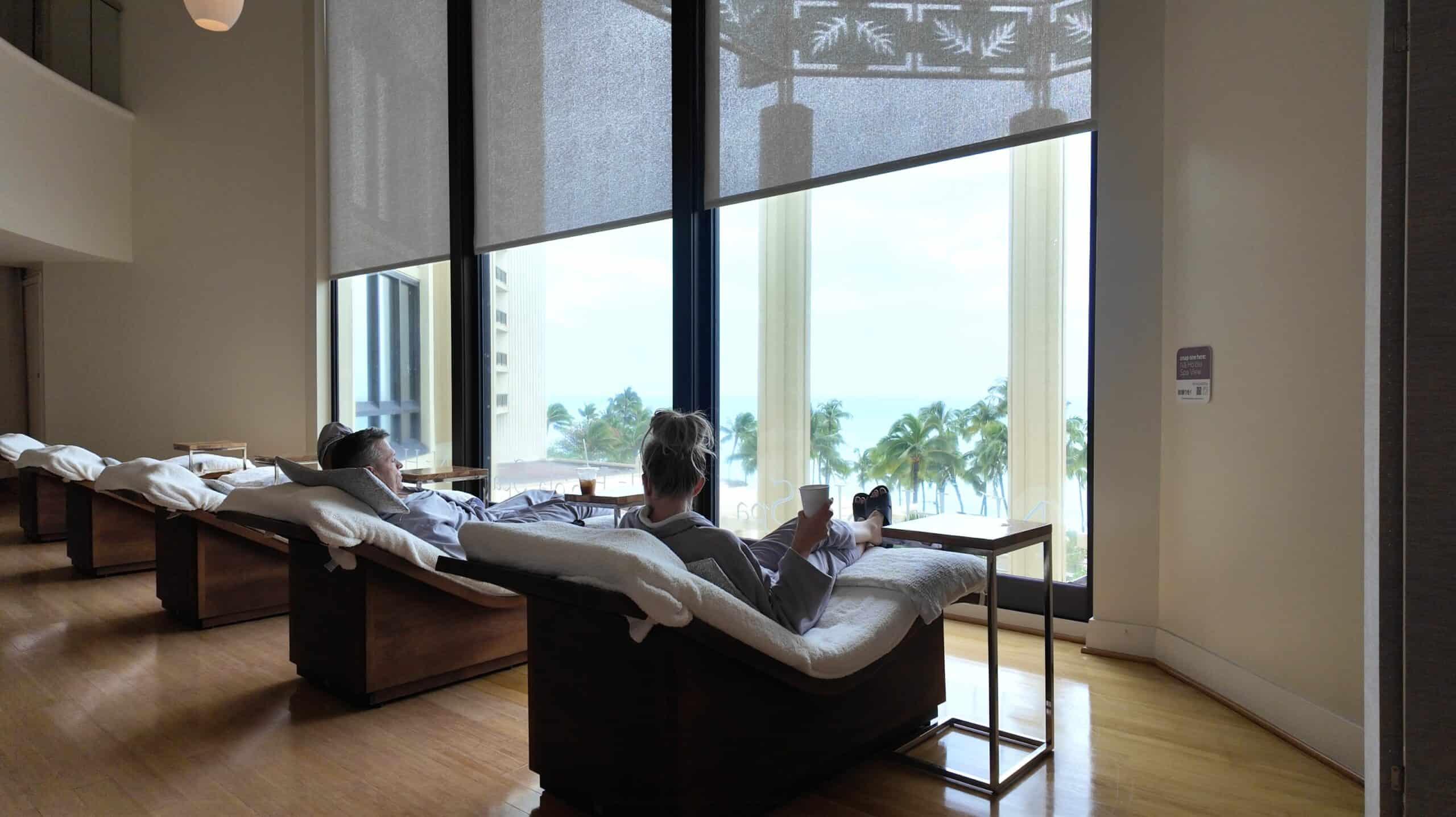 A couple sitting in the relaxation lounge at the Na Ho’ola Spa