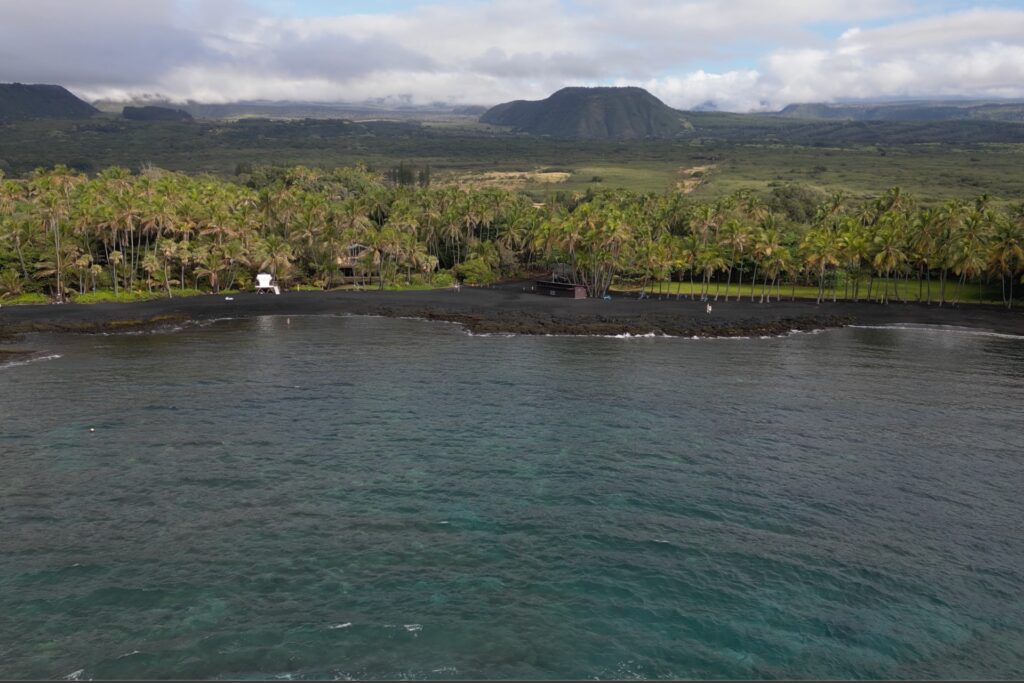 A view from the ocean of Punaluʻu Black Sand Beach on the Island of Hawaii