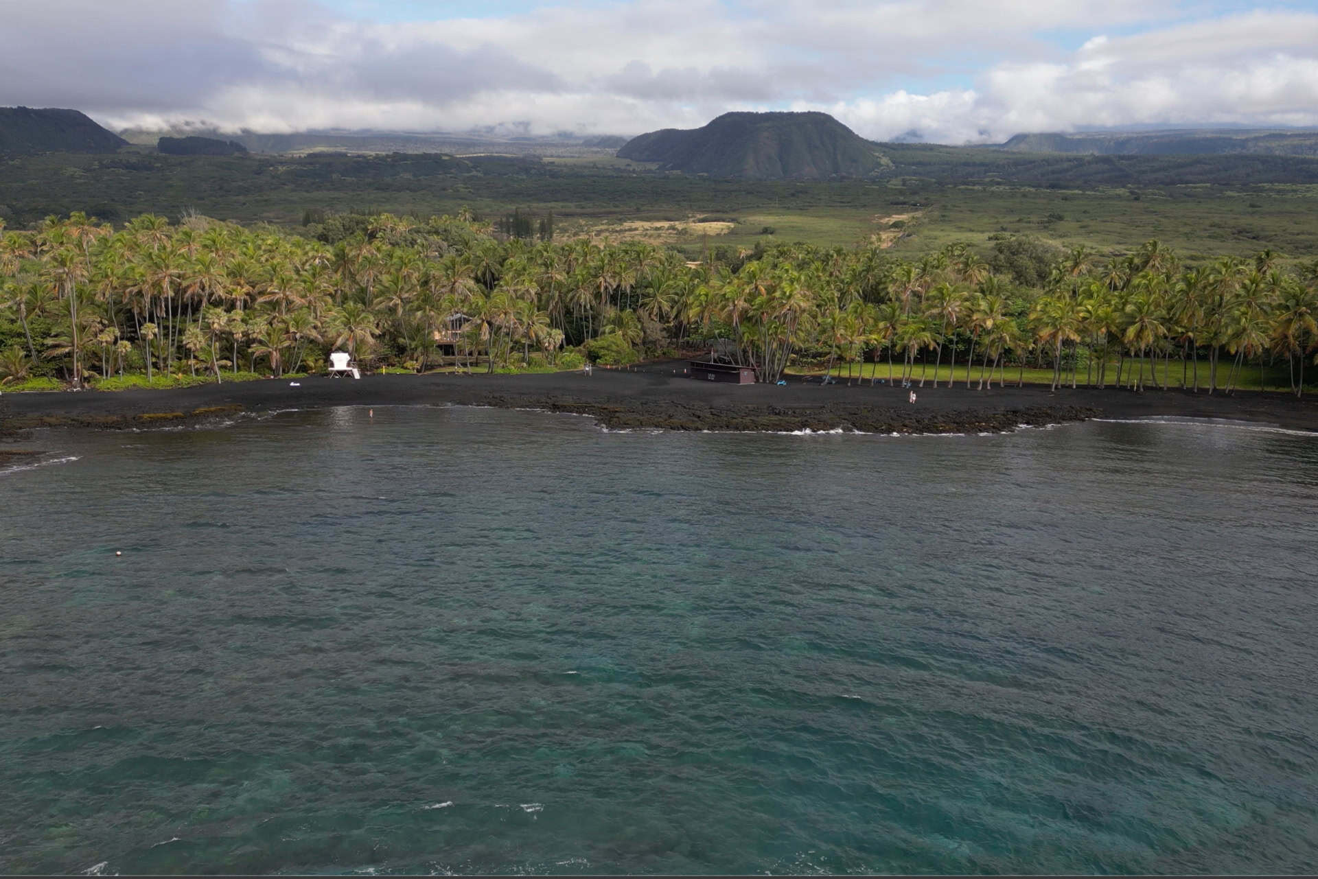 A view from the ocean of Punaluʻu Black Sand Beach on the Island of Hawaii
