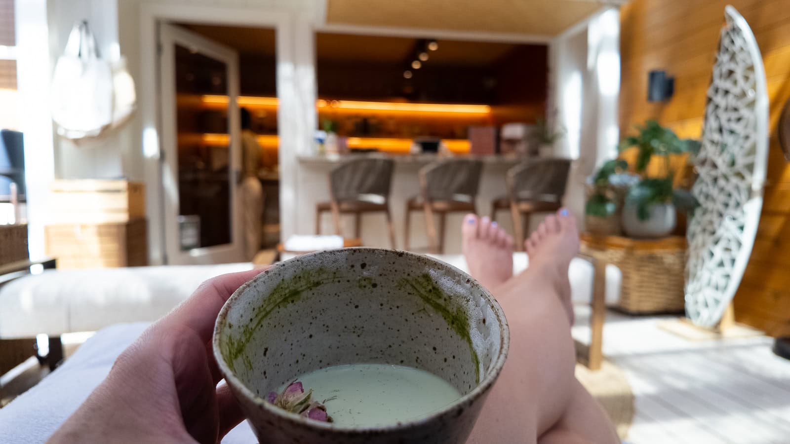 Travel writer Jenny White enjoying homemade matcha and a botanical massage at Scape on Maui's North Shore