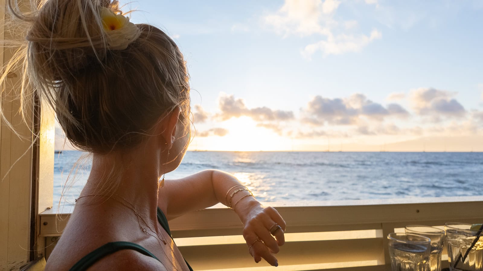 Travel writer Jenny White looking out at the Maui sunset from Mala Ocean Tavern's patio in Lahaina