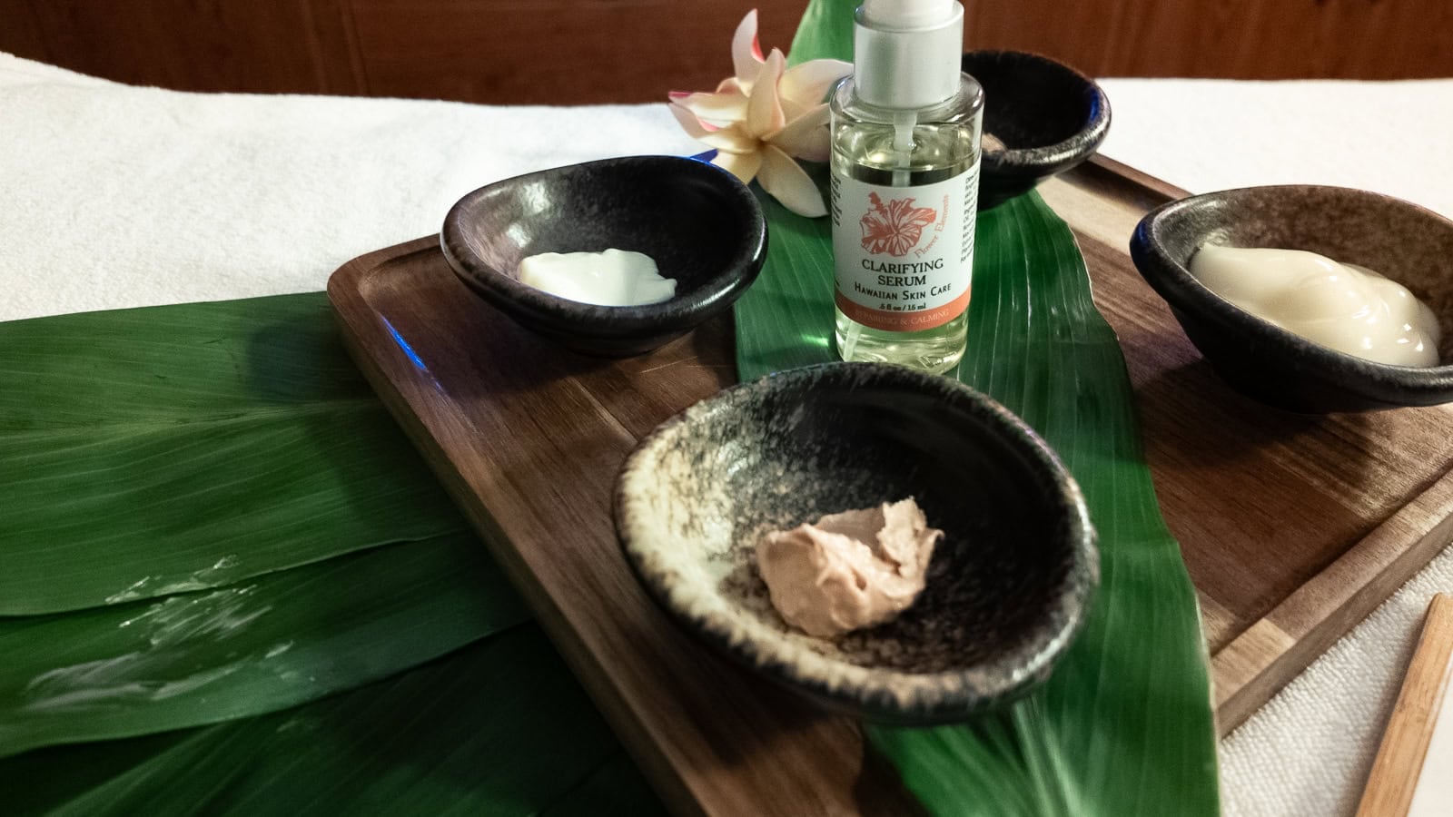 Oils, creams and salts on a tropical ti leaf, prepared for a body treatment at the Fairmont Spa Kea Lani