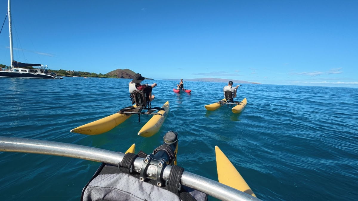 Traveler Jenny White and family on water bikes at Mākena Bay in Maui for a morning tour with Surf Cycling